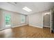 Basement with wood floors, window, and a walk-out door at 327 Red Fox Dr, Canton, GA 30114