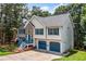 Charming two-story home featuring a two-car garage, stone accents, and manicured lawn at 327 Red Fox Dr, Canton, GA 30114