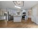 Bright kitchen with blue cabinets, stainless steel appliances, island and wood floors at 327 Red Fox Dr, Canton, GA 30114