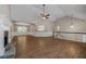 Spacious living room with gorgeous wood floors, stone fireplace, and an open layout at 327 Red Fox Dr, Canton, GA 30114