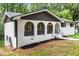 Charming home featuring a light-colored brick facade and lovely arched entryway at 3530 Turner Heights Dr, Decatur, GA 30032