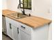 Kitchenette area with butcher block countertops, stainless steel sink, and modern cabinets at 3530 Turner Heights Dr, Decatur, GA 30032