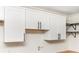 Kitchen featuring white cabinets with black hardware and upper cabinets at 3530 Turner Heights Dr, Decatur, GA 30032