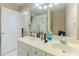 Bathroom showcasing a double sink vanity with great lighting, a large mirror, and updated fixtures at 1311 Primrose View Cir, Lawrenceville, GA 30044
