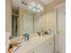 Bathroom featuring a single sink vanity, large mirror, great lighting and bathtub shower at 1311 Primrose View Cir, Lawrenceville, GA 30044