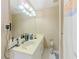 Bright bathroom featuring a sleek vanity, contemporary lighting, and a large mirror for a modern feel at 1311 Primrose View Cir, Lawrenceville, GA 30044