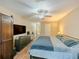 Large bedroom featuring hardwood floors and a ceiling fan at 1311 Primrose View Cir, Lawrenceville, GA 30044