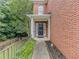 Close-up of the brick home's inviting front door, framed by columns and manicured landscaping at 1311 Primrose View Cir, Lawrenceville, GA 30044