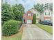 Charming two-story home with a brick facade, attached garage, and lush green landscaping at 1311 Primrose View Cir, Lawrenceville, GA 30044
