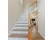 Bright, carpeted staircase leads to the upper level, showcasing the home's open floor plan at 1311 Primrose View Cir, Lawrenceville, GA 30044