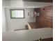 Cozy bathroom with hardwood floors, vintage cabinetry, and a window for natural light at 408 Hasty Trl, Canton, GA 30115