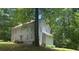 Two-story home with light-blue siding with a tree in the front yard providing shade at 408 Hasty Trl, Canton, GA 30115