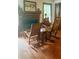 A cozy living room with a fireplace and rocking chairs at 408 Hasty Trl, Canton, GA 30115
