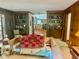 Cozy living room with hardwood floors, built-in shelves, and doorway to the kitchen at 408 Hasty Trl, Canton, GA 30115