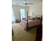 A classic main bedroom featuring a canopy bed and a window with a view at 408 Hasty Trl, Canton, GA 30115