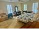 A traditionally decorated main bedroom featuring classic furnishings and ample natural light at 408 Hasty Trl, Canton, GA 30115