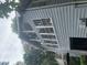 Exterior side view of the sunroom addition with lots of large windows at 408 Hasty Trl, Canton, GA 30115