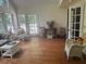 Spacious sunroom with hardwood floors and plenty of natural light at 408 Hasty Trl, Canton, GA 30115
