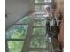Bright sunroom interior with lots of windows and light-colored furniture at 408 Hasty Trl, Canton, GA 30115