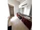 Bathroom featuring a double sink vanity, and a large mirror at 7178 Glaspie Way, Atlanta, GA 30349