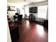 Bedroom setup as office with hardwood floors, neutral colors and window for natural lighting at 7178 Glaspie Way, Atlanta, GA 30349