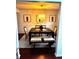 Lovely dining room with dark table, light fixture, bench and neutral rug at 7178 Glaspie Way, Atlanta, GA 30349