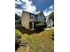 View of the house highlighting the side and back of the home plus lawn at 7178 Glaspie Way, Atlanta, GA 30349