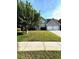 Traditional two-story home with a well-manicured lawn and a two-car garage at 7178 Glaspie Way, Atlanta, GA 30349
