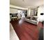 Spacious living room with hardwood floors and neutral colors, with stairway to second floor at 7178 Glaspie Way, Atlanta, GA 30349