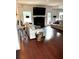 Comfortable living room with hardwood flooring, fireplace, and bright, natural lighting at 7178 Glaspie Way, Atlanta, GA 30349