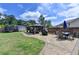 Expansive backyard with gazebo, dining area, shed, trampoline, and lush green lawn at 2410 Melton Common Dr, Dacula, GA 30019