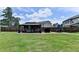 Expansive backyard featuring a patio with a gazebo, grilling area, and lush green lawn at 2410 Melton Common Dr, Dacula, GA 30019