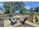 Enjoy this cozy backyard with a stone fire pit and built in seating at 2410 Melton Common Dr, Dacula, GA 30019