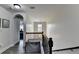 Hallway features arched doorway, hardwood floors and leads to the main bedroom at 2410 Melton Common Dr, Dacula, GA 30019
