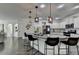 Bright kitchen with an island offers pendant lighting, modern appliances, and ample counter space, great for cooking at 2410 Melton Common Dr, Dacula, GA 30019