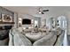 Cozy living room features a fireplace, built-in shelving, and comfortable seating area for relaxing and entertaining at 2410 Melton Common Dr, Dacula, GA 30019