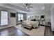 Beautiful main bedroom with door to patio and ceiling fan for year round comfort at 2410 Melton Common Dr, Dacula, GA 30019