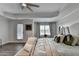 Bright main bedroom with a door to patio, beautiful bed and neutral colors at 2410 Melton Common Dr, Dacula, GA 30019
