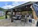 Stylish outdoor gazebo featuring comfortable seating, perfect for relaxation and entertaining guests at 2410 Melton Common Dr, Dacula, GA 30019