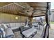 Outdoor living space showcasing a covered patio, comfortable seating, and a ceiling fan at 2410 Melton Common Dr, Dacula, GA 30019
