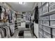 Large walk-in closet with built-in organizers for shoes, handbags, and clothing at 2410 Melton Common Dr, Dacula, GA 30019