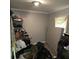 A cluttered bedroom with a mattress and disorganized shelves at 3025 Butler Creek Nw Rd, Kennesaw, GA 30152