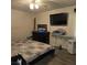 Bedroom with queen bed, television, and dark wood dresser at 3025 Butler Creek Nw Rd, Kennesaw, GA 30152
