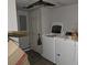 Laundry room with washer, dryer, and ceiling damage at 3025 Butler Creek Nw Rd, Kennesaw, GA 30152