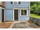 The exterior showcases blue siding and a black front door, complemented by a small window at 428 Medlock Rd, Decatur, GA 30030