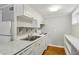 Kitchen featuring white cabinets, a stainless steel sink, and modern appliances at 428 Medlock Rd, Decatur, GA 30030