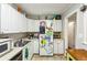 Bright kitchen with white cabinets, stainless steel appliances, and convenient layout at 428 Medlock Rd, Decatur, GA 30030