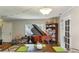 Spacious living room with a decorative chandelier, hardwood flooring, and access to other living spaces at 428 Medlock Rd, Decatur, GA 30030