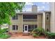 Back exterior view of a two-story townhome featuring a balcony and screened porch at 67 Middleton Se Ct, Smyrna, GA 30080