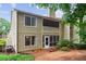 The backyard has a screened porch and balcony perfect for relaxing and entertaining at 67 Middleton Se Ct, Smyrna, GA 30080